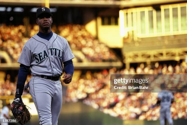 Center fielder Ken Griffey Jr. Of the Seattle Mariners stands on the field during a game against the Colorado Rockies at Coors Field in Denver,...
