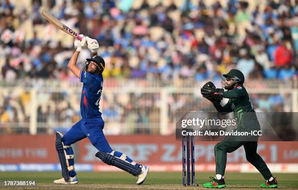 Dawid Malan of England plays a shot as Muhammad Rizwan of Pakistan keeps during the ICC Men's Cricket World Cup India 2023 between England and...