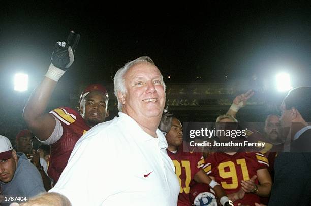 Head coach John Robinson of the USC Trojans celebrates his 100th win after a game against the UNLV Running Rebels at the Los Angeles Coliseum in Los...