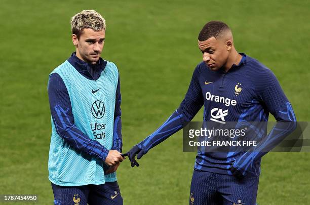 France's forward Antoine Griezmann and France's forward Kylian Mbappe take part in a training session at the Allianz Riviera Stadium in Nice,...