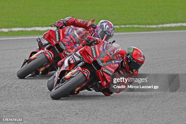 Francesco Bagnaia of Italy and Ducati Lenovo Team leads Enea Bastianini of Italy and Ducati Lenovo Team during the MotoGP of Malaysia - Sprint at...