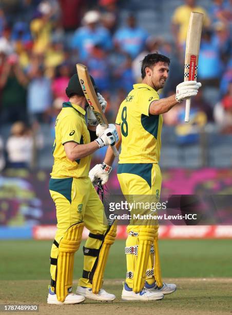 Mitch Marsh of Australia celebrates his century with team mate Steve Smith during the ICC Men's Cricket World Cup India 2023 between Australia and...