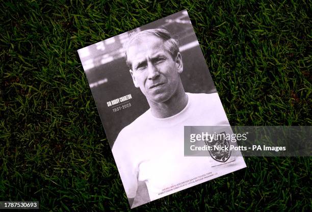 Match programme paying tribute to Sir Bobby Charlton on the pitch ahead of the UEFA Euro 2024 Qualifying Group C match at Wembley Stadium, London....