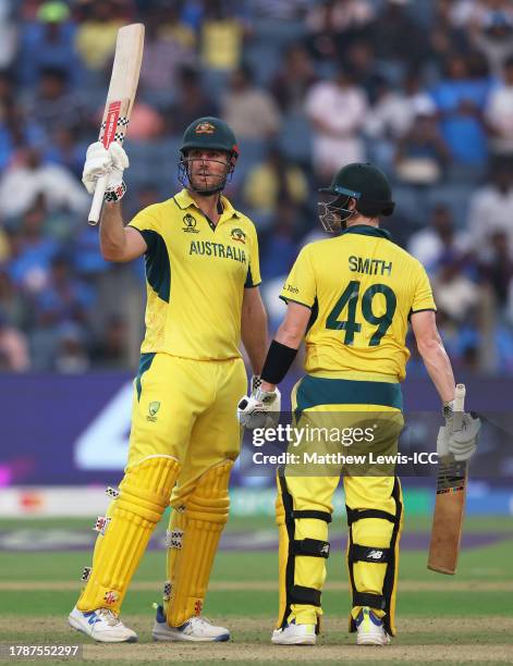 Mitch Marsh of Australia celebrates his 150 with team mate Steve Smith during the ICC Men's Cricket World Cup India 2023 between Australia and...