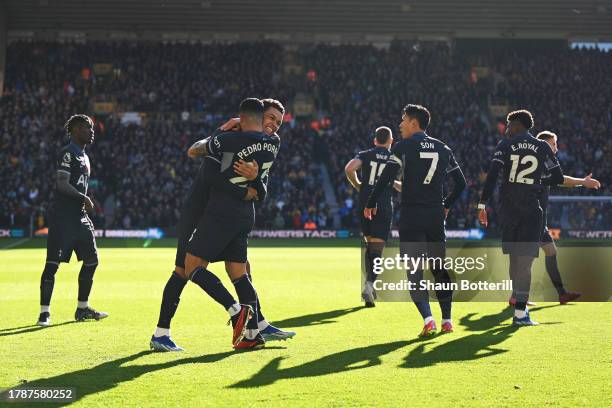 Brennan Johnson of Tottenham Hotspur celebrates with teammate Pedro Porro after scoring the team's first goal during the Premier League match between...