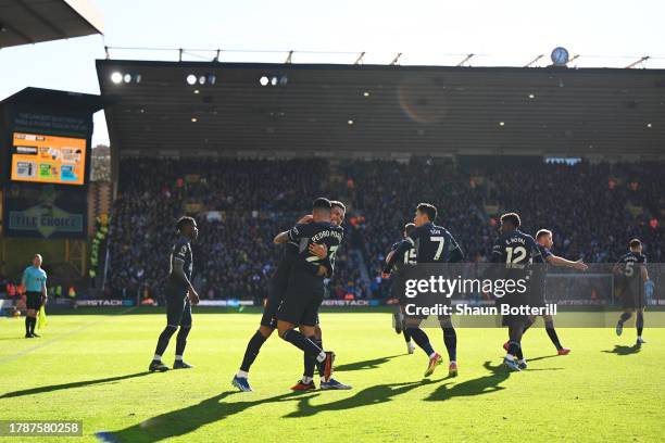 Brennan Johnson of Tottenham Hotspur celebrates with teammate Pedro Porro after scoring the team's first goal during the Premier League match between...