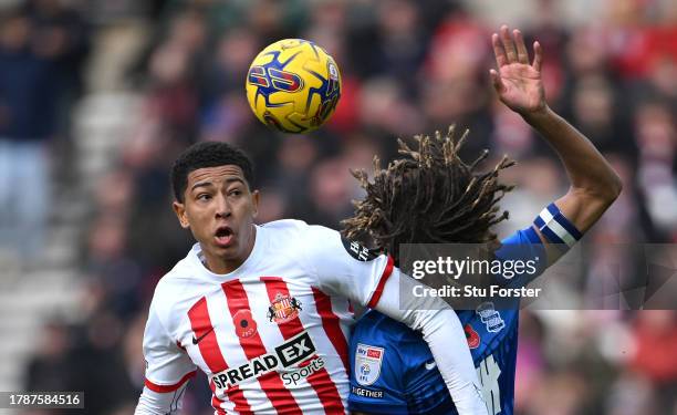 Sunderland player Jobe Bellingham is challenged by Dion Sanderson of Birmingham during the Sky Bet Championship match between Sunderland and...