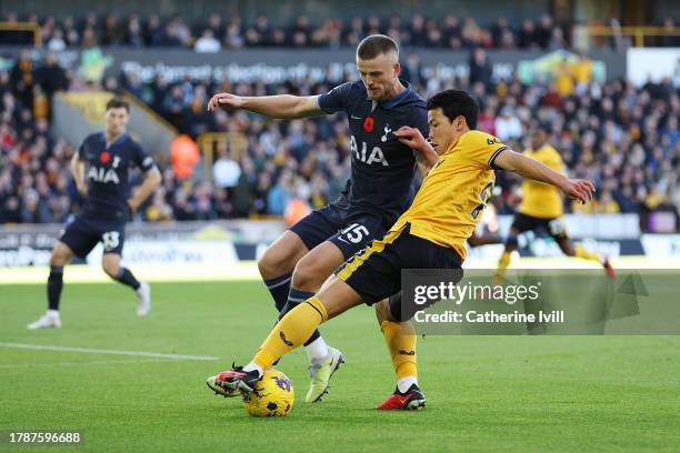 Eric Dier of Tottenham Hotspur and Hwang Hee-Chan of Wolverhampton Wanderers battle for possession during the Premier League match between...