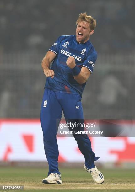 David Willey of England celebrates the wicket of Abdullah Shafique of Pakistan during the ICC Men's Cricket World Cup India 2023 between England and...