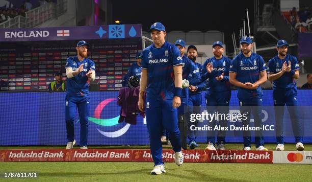 David Willey of England leads the sides out to field in their final match before international retirement during the ICC Men's Cricket World Cup...