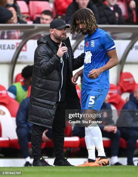 Birmingham City manager Wayne Rooney gives advice to captain Dion Sanderson during the Sky Bet Championship match between Sunderland and Birmingham...