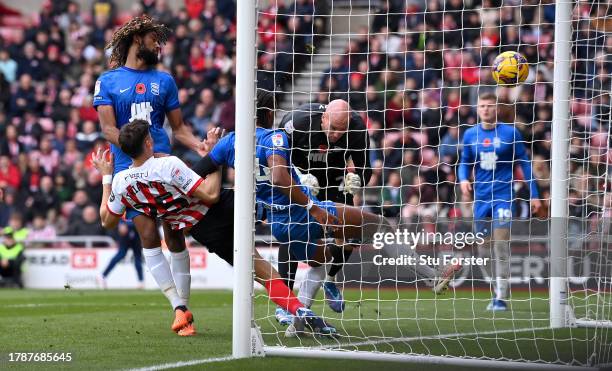 Sunderland player Nectar Triantis beats Birmingham defender Emanuel Aiwu to score the second goal during the Sky Bet Championship match between...