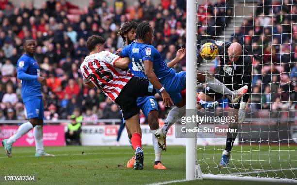 Sunderland player Nectar Triantis beats Birmingham defender Emanuel Aiwu to score the second goal during the Sky Bet Championship match between...