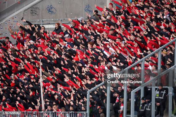 Mainz 05 fans show their support from the stands ahead of the Bundesliga match between SV Darmstadt 98 and 1. FSV Mainz 05 at Merck-Stadion am...