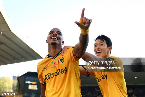 Mario Lemina of Wolverhampton Wanderers celebrates with teammate Hwang Hee-Chan after scoring the team's second goal during the Premier League match...