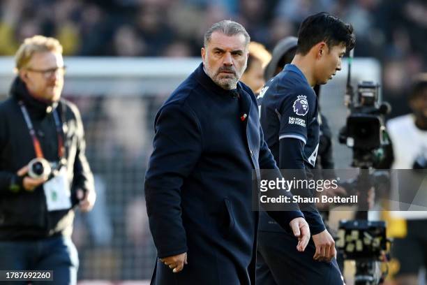 Ange Postecoglou, Manager of Tottenham Hotspur, looks dejected after the team's defeat in the Premier League match between Wolverhampton Wanderers...