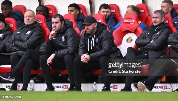 Birmingham City manager Wayne Rooney and coach John O' Shea look on from the bench during the Sky Bet Championship match between Sunderland and...