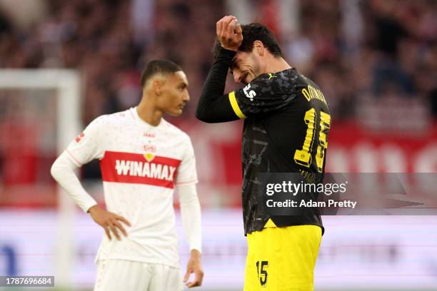 Mats Hummels of Borussia Dortmund looks dejected following his substitution after sustaining an injury during the Bundesliga match between VfB...