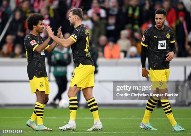 Niclas Fuellkrug of Borussia Dortmund celebrates with teammate Karim Adeyemi after scoring the team's first goal during the Bundesliga match between...