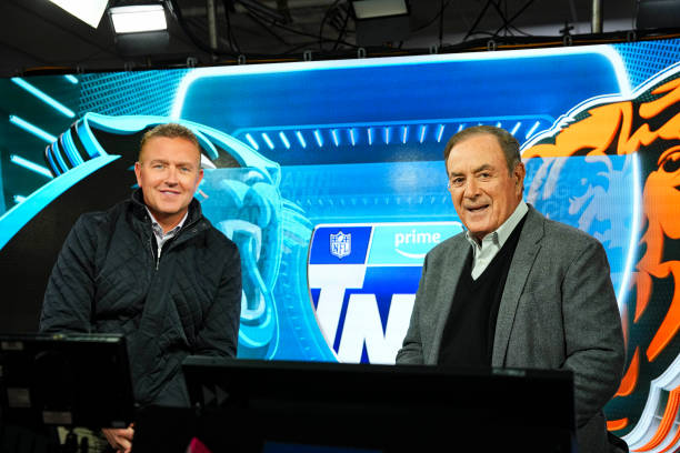 Kirk Herbstreit and Al Michaels in the Amazon Prime TNF broadcast booth prior to an NFL football game between the Carolina Panthers and the Chicago...