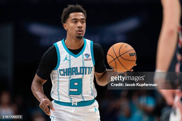 Theo Maledon of the Charlotte Hornets brings the ball up court /W during their game at Spectrum Center on November 08, 2023 in Charlotte, North...