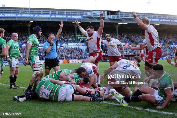 Harlequins celebrate after Dino Lamb scores their second try during the Gallagher Premiership Rugby match between Leicester Tigers and Harlequins at...