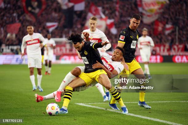 Jamie Leweling of VfB Stuttgart is challenged by Rami Bensebaini of Borussia Dortmund during the Bundesliga match between VfB Stuttgart and Borussia...