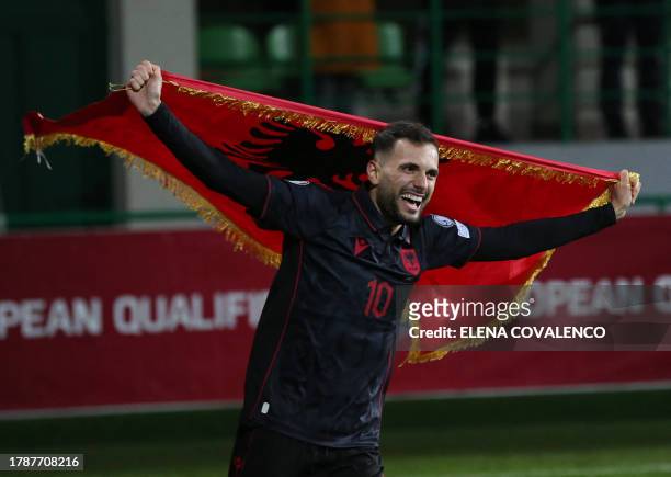 Albania's midfielder Nedim Bajrami celebrates the qualification after the UEFA Euro 2024 Group E qualifying football match between Moldova and...