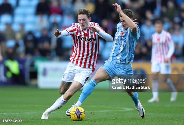 Wouter Burger of Stoke City and Ben Sheaf of Coventry compete for the ball during the Sky Bet Championship match between Coventry City and Stoke City...
