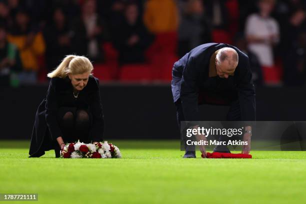 Sir Geoff Hurst lays a reef and football shirt in memory of the former Manchester United and England footballer Sir Bobby Charlton ahead during the...