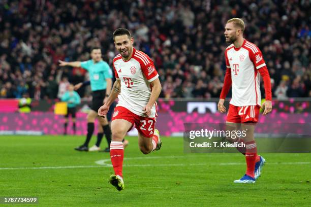 Raphael Guerreiro of Bayern Munich celebrates after scoring the team's third goal during the Bundesliga match between FC Bayern München and 1. FC...