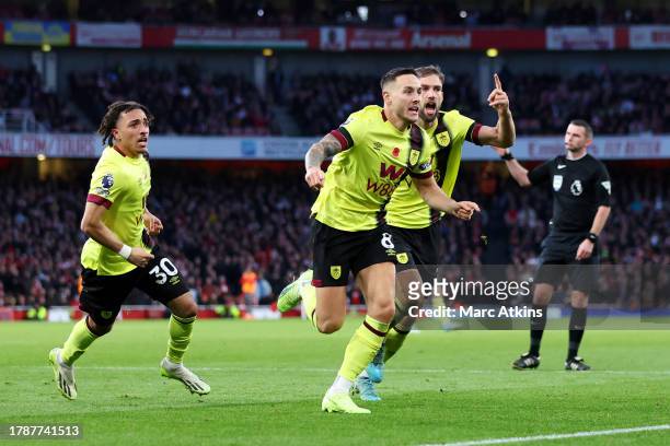 Josh Brownhill of Burnley celebrates with teammates after scoring the team's first goal during the Premier League match between Arsenal FC and...
