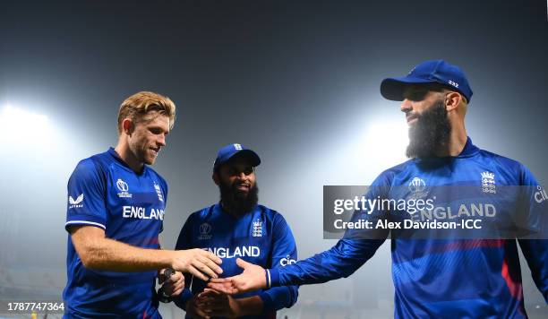 David Willey, Adil Rashid and Moeen Ali of England interact following the ICC Men's Cricket World Cup India 2023 between England and Pakistan at Eden...