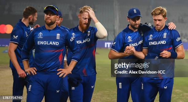 David Willey and Chris Woakes of England interact following the ICC Men's Cricket World Cup India 2023 between England and Pakistan at Eden Gardens...
