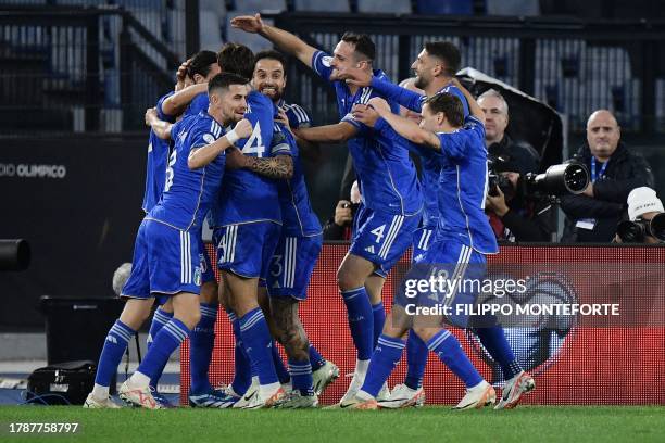 Italy's defender Matteo Darmian celebrates with teammates after scoring team's first goal during the UEFA Euro 2024 qualifying Group C football match...