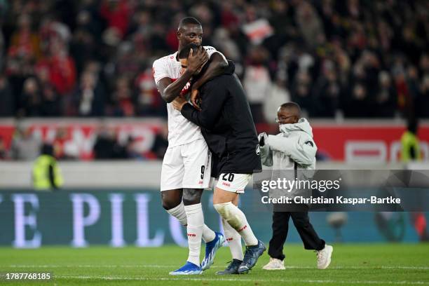 Sehrou Guirassy and Deniz Undav of VfB Stuttgart celebrate after the team's victory in the Bundesliga match between VfB Stuttgart and Borussia...