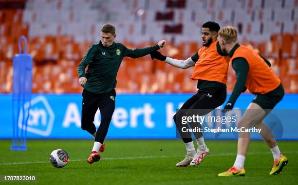 Amsterdam , Netherlands - 17 November 2023; James McClean with Andrew Omobamidele and Liam Scales, right, during a Republic of Ireland training...