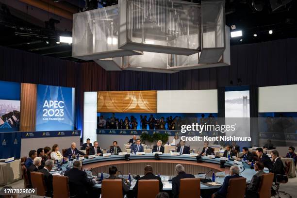 World leaders sit around a table during the APEC Leaders Retreat on the last day of the Asia-Pacific Economic Cooperation Leaders' Week at Moscone...