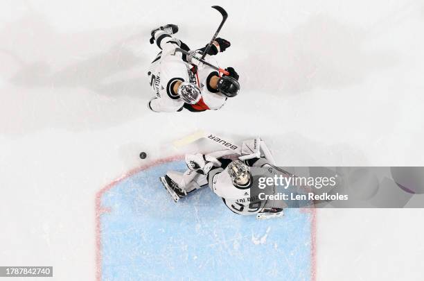 Andreas Englund and Cam Talbot of the Los Angeles Kings stop a shot on goal by Morgan Frost of the Philadelphia Flyers at the Wells Fargo Center on...