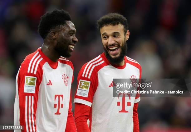 Alphonso Davies of FC Bayern Muenchen , Noussair Mazraoui of FC Bayern Muenchen celebrate victory after the Bundesliga match between FC Bayern...
