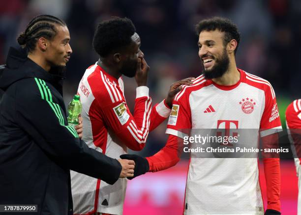 Alphonso Davies of FC Bayern Muenchen , Noussair Mazraoui of FC Bayern Muenchen , Leroy Sane of FC Bayern Muenchen celebrate victory after the...