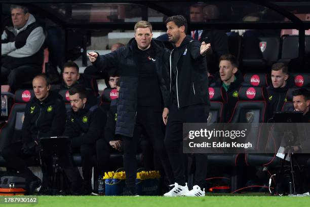 Eddie Howe, Manager of Newcastle United, speaks with Jason Tindall, Assistant Manager of Newcastle United during the Premier League match between AFC...