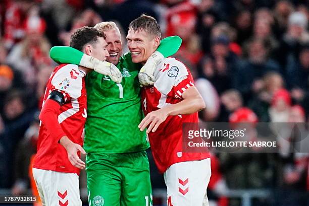 Denmark's defender Andreas Christensen, Denmark's goalkeeper Kasper Schmeichel and Denmark's defender Jannik Vestergaard celebrate after the UEFA...