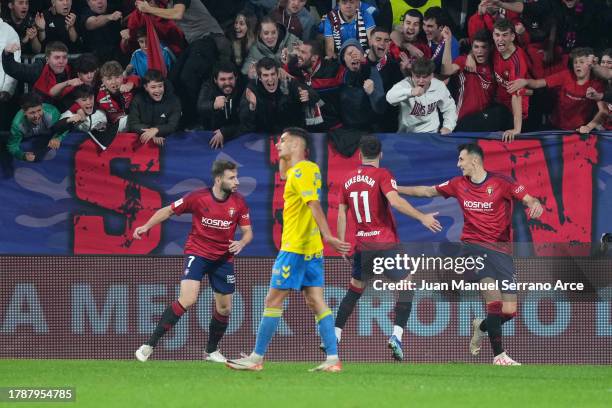 Ante Budimir of CA Osasuna celebrates with teammates Jon Moncayola and Kike Barja after scoring the team's first goal during the LaLiga EA Sports...