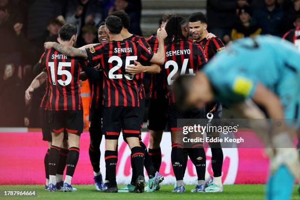 Dominic Solanke of AFC Bournemouth celebrates with teammates after scoring the team's second goal during the Premier League match between AFC...