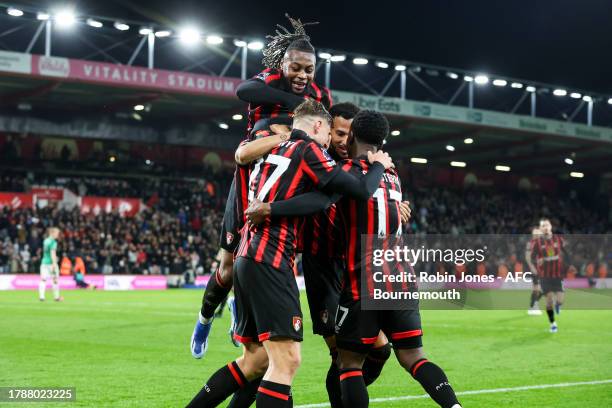Dominic Solanke of Bournemouth scores a goal to make it 2-0 at the near post and is mobbed by team-mates during the Premier League match between AFC...