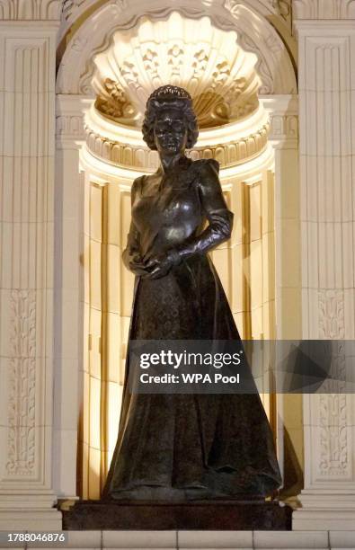 Statue of Britain's Queen Elizabeth II is lit up after unveiling by King Charles III as he arrives to attend the Royal British Legion Festival of...