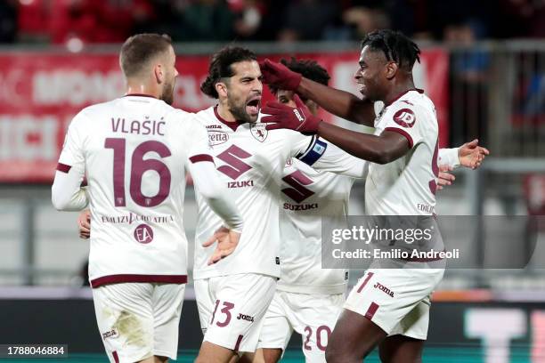 Ricardo Rodriguez of Torino FC celebrates with teammate Nikola Vlasic , Valentino Lazaro Duvan Zapata after scoring the team's first goal that was...