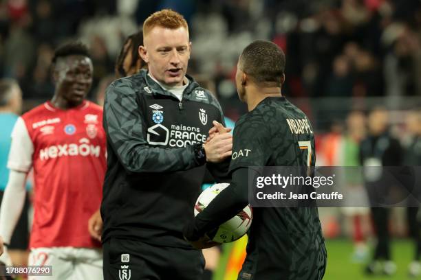 Coach of Stade de Reims Will Still aka William Still congratulates Kylian Mbappe of PSG following the Ligue 1 Uber Eats match between Stade de Reims...