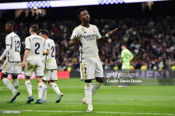 Vinicius Junior of Real Madrid celebrates after scoring the team's second goal during the LaLiga EA Sports match between Real Madrid CF and Valencia...